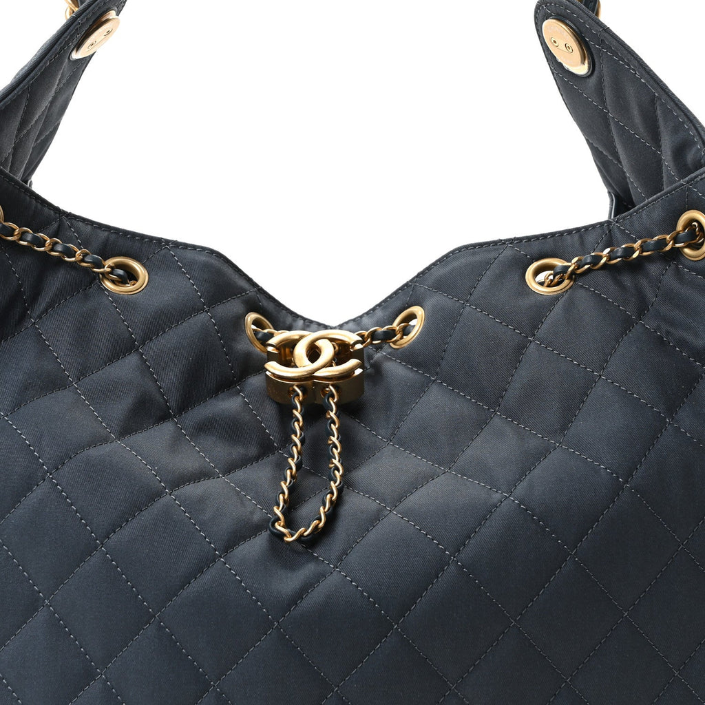 Canvas Quilted Medium Chanel 25 Handbag Dark Blue